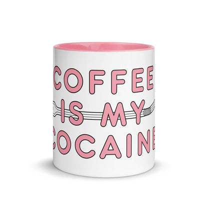 Wit-roze mok met de tekst 'cocaine is my coffee', ontwerp door Matzwart en verkrijgbaar bij cadeauwinkel 'A Given Horse'. Voorkant.