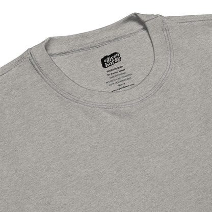 Lichtgrijze trui met een supersoaker geborduurd op de borst, ontwerp door De Zwarte Markt en verkrijgbaar bij cadeauwinkel 'A Given Horse'. Detail.